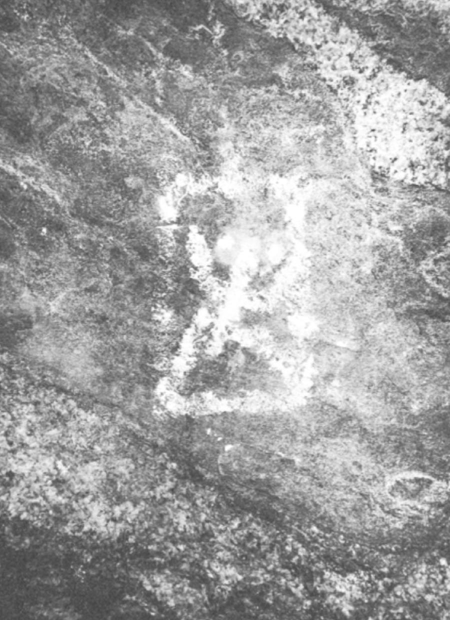 A chalk figure drawn on a rock face
